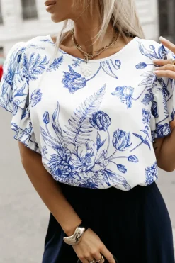 BLUZKA KOSZULOWA LAMBI Z MOTYLKOWYM RĘKAWEM BIAŁO-GRANATOWA W KWIATY