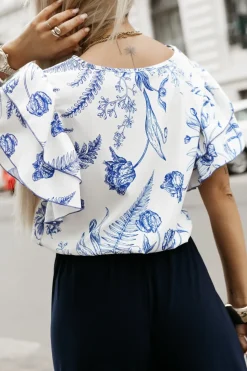 BLUZKA KOSZULOWA LAMBI Z MOTYLKOWYM RĘKAWEM BIAŁO-GRANATOWA W KWIATY